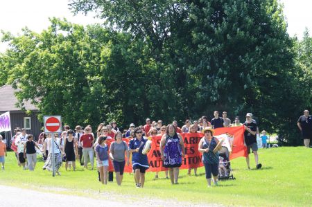 One hundred people at the rally followed drummers to highway 344 for a round dance, slowing down traffic. PHOTO: Arij Riahi.