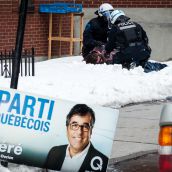 Montreal Riot Police performing arrest during Montreal's 18th annual Protest against Police Brutality.