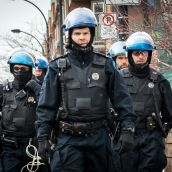 Light Armored Riot Police move in to surround the gathering at Montreal's 18th annual Protest against Police Brutality.