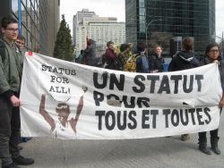 Inside and outside of the conference, people demand Justice for All! Dedans et hors du conférence, les personnes exigent un statut pour tout.e.s