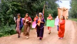 from the video "The March Into Poignan" capturing the Women Elders signal to protect the land